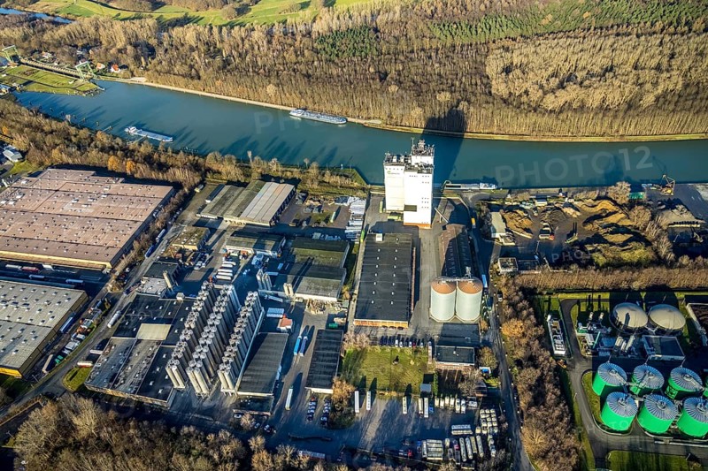 Aerial view Agravis silo tower concentrated feed plant in the industrial area east at the Wesel-Datteln canal in Dorsten in the Ruhr area in North Rhine-Westphalia, Germany, Agravis Raiffeisen AG, DE, Germany, Dorsten, Europe, commercial enterprises, commercial area, commercial park, commercial location, commercial use, industrial area, industrial building, industrial location, aerial view, aerial photograph, aerial photography, aerial photography, North Rhine-Westphalia, Ruhr area, overview, bird's-eye view, Wesel-Datteln Canal, birds-eyes view, compound feed manufacturer, overview