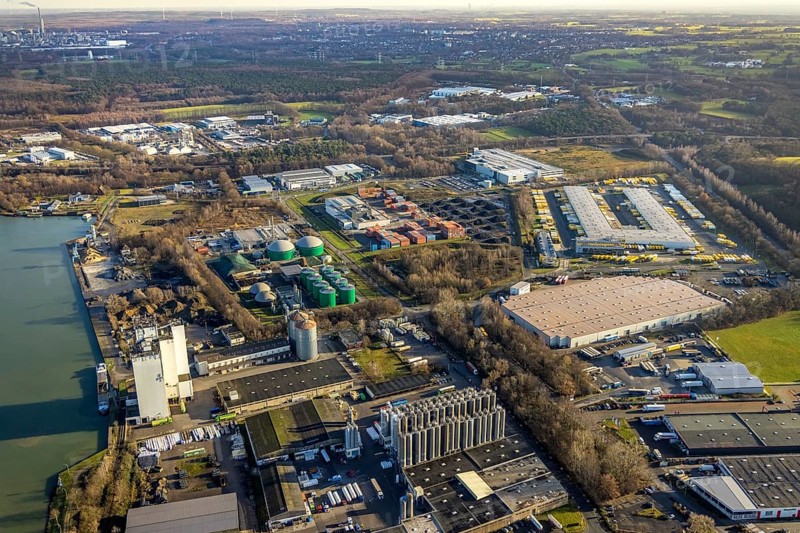 Aerial view of the Industrial Park East Dorsten-Marl with the Agravis silo tower concentrated feed plant and the biogas plant Dorsten and the DHL freight centre in the Lünsingskuhle in Dorsten in the Ruhr area in North Rhine-Westphalia, Germany, DE, Germany, Dorsten, Europe, commercial enterprises, commercial area, commercial park, commercial location, commercial use, freight traffic, industrial area, industrial building, industrial location, logistics, logistics service, logistics service provider, logistics provider, logistics centre, aerial view, aerial photograph, aerial photography, aerial photography, North Rhine-Westphalia, Ruhr area, freight forwarding, transport, transport service, overview, bird's-eye view, overview