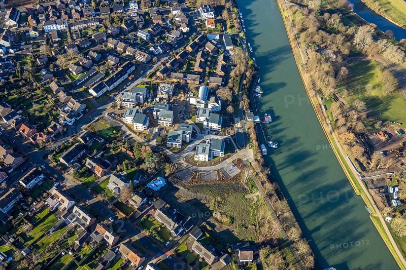 Aerial view of a construction site and new construction of residential buildings with barrier-free flats on the Wesel-Datteln Canal, Zum Leinpfad in Dorsten in the Ruhr area in North Rhine-Westphalia, Germany, construction work, construction, construction area, building site, building plots, construction measure, construction project, building site, boats, jetty, jetty, DE, Germany, Dorsten, development, Europe, capacity requirements, aerial view, aerial photography, aerial photography, aerial photography, motorboats, new construction, North Rhine-Westphalia, Ruhr area, ship, overview, bird's-eye view, Wesel-Datteln Canal, barrier-free living, birds-eyes view, overview