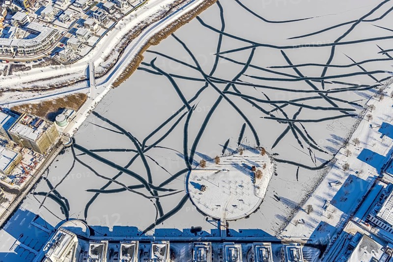 Aerial view, snowy Phoenix Lake, Hörde, Dortmund, Ruhr area, North Rhine-Westphalia, Germany, DE, Europe, aerial photography, aerial photography, aerial photography, snow, lake, overview, bird's eye view, winter, winter slump, winter landscape, birds-eyes view, overview, ice, ice surface, thin ice, break in the ice, breaks in the ice, snowy ice surface, artificial lake