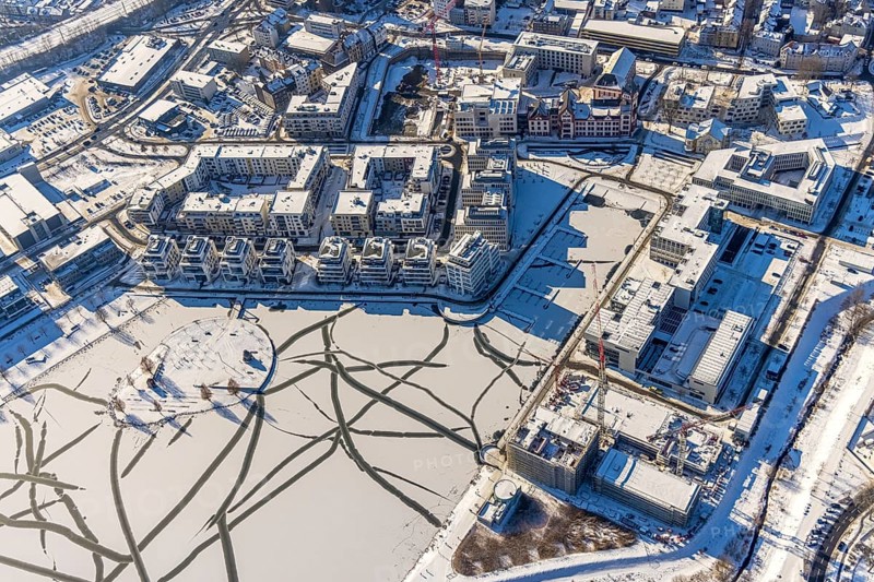Aerial view, snow-covered Phoenix Lake, Hörder Burg, construction site of a retirement home, Hörde, Dortmund, Ruhr area, North Rhine-Westphalia, Germany, DE, Europe, commercial buildings, harbour, aerial view, aerial photography, aerial photography, snow, lake, overview, bird's eye view, winter, winter slump, winter landscape, birds-eyes view, overview, ice, ice surface, thin ice, break in the ice, breaks in the ice, snow-covered ice surface, artificial lake