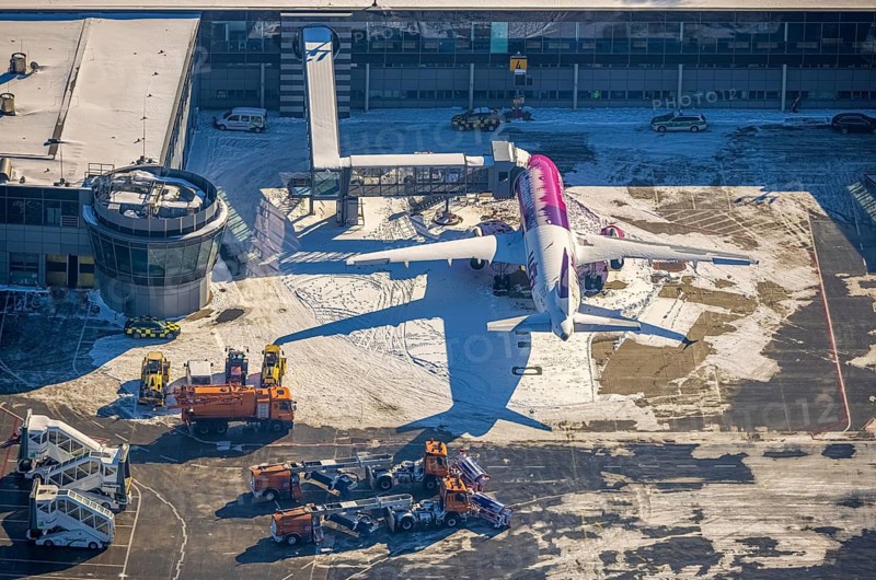 Aerial photo, Dortmund airport in winter, aeroplane, Wickede, Dortmund, Ruhr area, North Rhine-Westphalia, Germany, DE, Europe, flight mission, airport, airfield, runway, aerial photo, aerial photography, aerial photography, snow, runway, overview, bird's-eye view, winter, onset of winter, winter landscape, birds-eyes view, overview