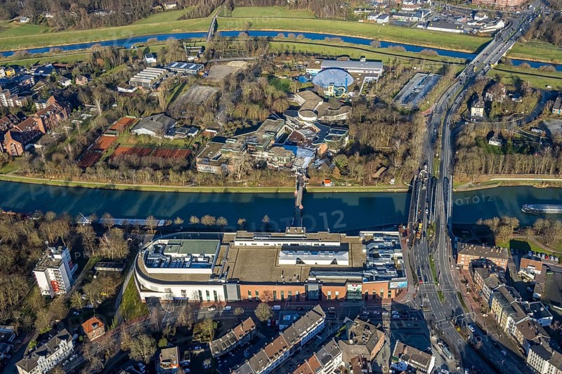 Aerial view of the shopping centre Mercaden Dorsten at the Westwall and Gymnasium Petrinum and leisure pool Atlantis at the Wesel-Datteln Canal in Dorsten in the Ruhr area in North Rhine-Westphalia, Germany, bridge, Crawleystraße, DE, Germany, Dorsten, shopping centre, shopping mall, shopping markets, shopping place, shopping centre, Europe, Hochstadenbrücke, Im Werth, aerial view, aerial photograph, aerial photography, aerial photography, local supply centre, North Rhine-Westphalia, Ruhr area, shopping, shopping, shopping centre, Dorsten municipal library, overview, VHS, bird's-eye view, Wesel-Datteln-Kanal, birds-eyes view, overview