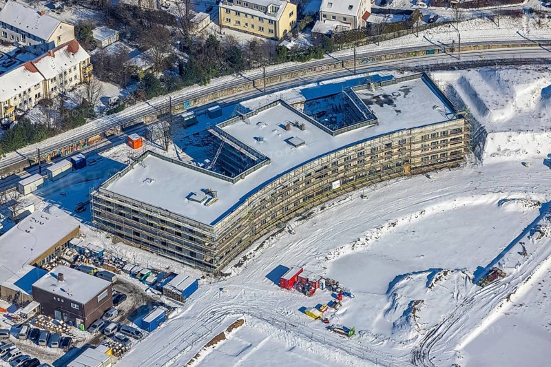 Aerial view, Hombrucher Bogen, construction site for commercial areas and apartment buildings, Barop, Dortmund, Ruhr area, North Rhine-Westphalia, Germany, construction work, construction area, construction site, building plots, construction project, construction site, DE, Europe, aerial view, aerial photography, aerial photography, new building, snow, overview, bird's eye view, winter, winter slump, winter landscape, birds-eyes view, former prefabricated concrete plant at Luisenglück, overview
