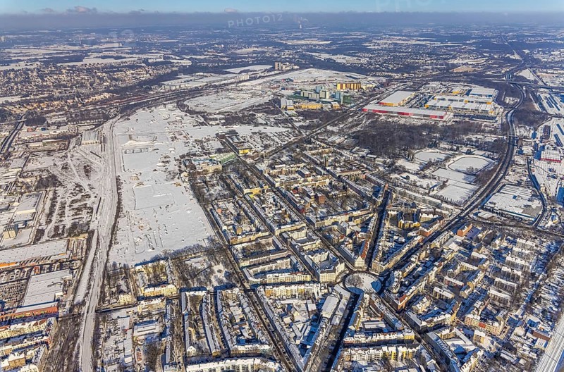 Aerial view, Westfalenhütte site, winter at Borsigplatz, Dortmund, Ruhr area, North Rhine-Westphalia, Germany, Amazon Logistik Dortmund, DE, Europe, commercial enterprises, commercial area, commercial park, commercial location, commercial use, industrial area, industrial location, roundabout, roundabout, aerial photograph, aerial photography, aerial photography, snow, overview, bird's-eye view, winter, onset of winter, winter landscape, living and life, residential buildings, bird's-eye view, overview, thyssenkrupp Steel Europe