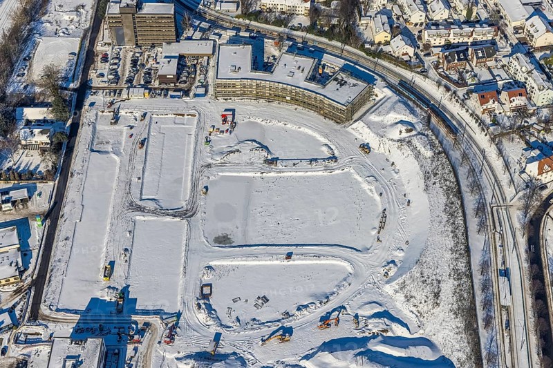 Aerial view, Hombrucher Bogen, construction site for commercial areas and apartment buildings, Barop, Dortmund, Ruhr area, North Rhine-Westphalia, Germany, construction work, construction area, construction site, building plots, construction project, construction site, DE, Europe, aerial view, aerial photography, aerial photography, new building, snow, overview, bird's eye view, winter, winter slump, winter landscape, birds-eyes view, former prefabricated concrete plant at Luisenglück, overview