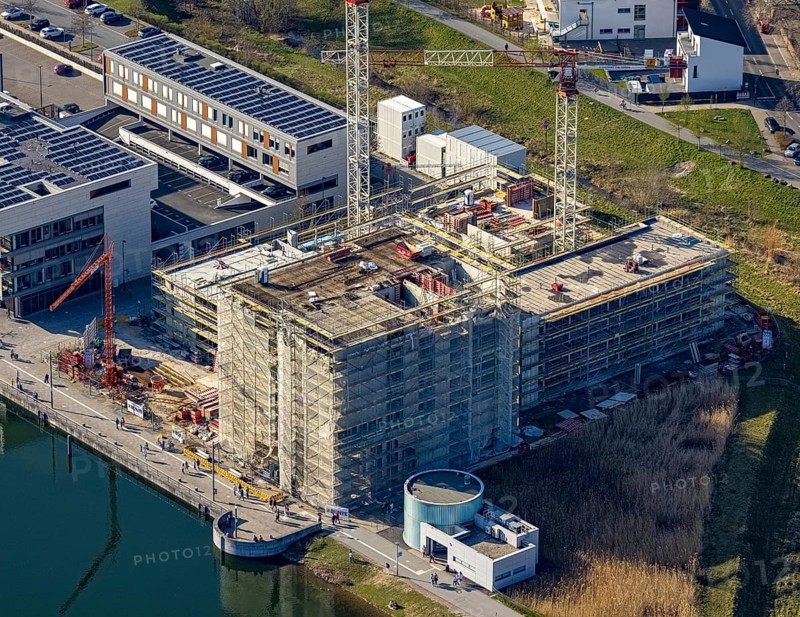 Aerial view, Phoenix-See, construction site for a new retirement home, high-rise building H12, Hörde, Dortmund, Ruhr area, North Rhine-Westphalia, Germany, construction work, construction area, construction site, building plots, construction crane, construction measure, construction project, construction site, DE, Europe, aerial view, aerial photography, aerial photography, new construction, Phoenix Lake, overview, bird's-eye view, former steelworks area Phoenix-East, artificial lake, overview