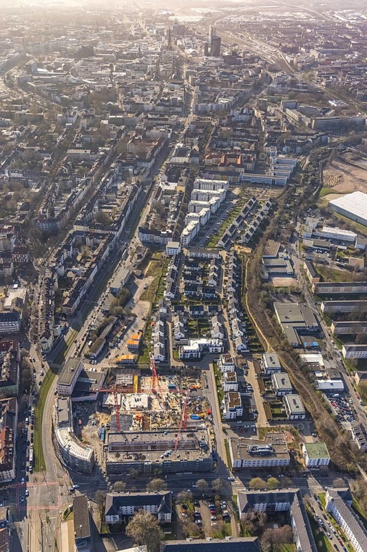 Aerial view, construction site for new Kaiserquartier, Klönnestraße, new development area Kaiserstraße, Kaiserbrunnen, Dortmund, Ruhr area, North Rhine-Westphalia, Germany, construction work, construction area, construction site, building plots, construction crane, construction project, construction site, DE, Europe, aerial view, aerial photography, aerial photography, new building, snow, overview, bird's-eye view, overview