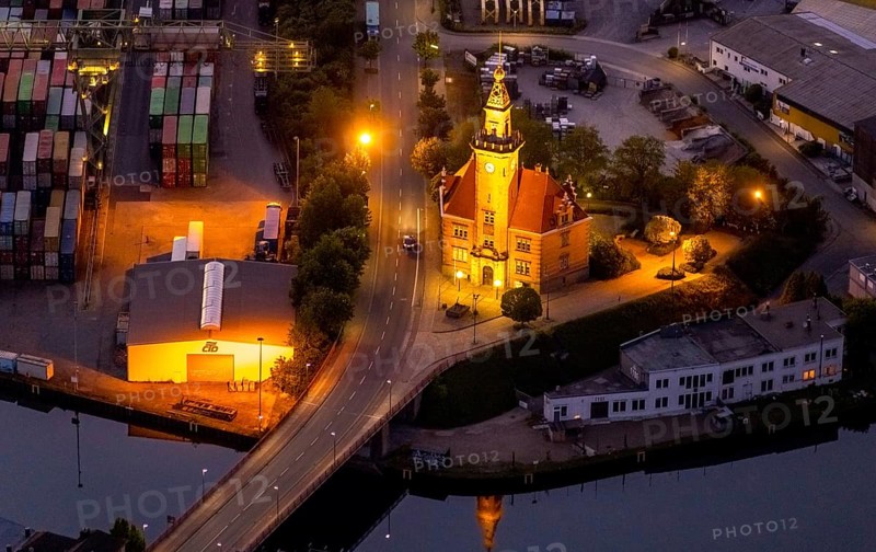 Aerial view, night view of Dortmund harbour, historic building old harbour office, coal port of the inland portDortmunder Hafen AG in Dortmund in the federal state of North Rhine-Westphalia, Germany, Dortmund, Ruhr area, North Rhine-Westphalia, DE, Europe, birds-eyes view, aerial view, aerial photography, aerial photography, overview, overview, bird's eye view, night flight, night shot, nightshot, twilight, inland port, inland port, Dortmund-Ems Canal, Speicherstraße