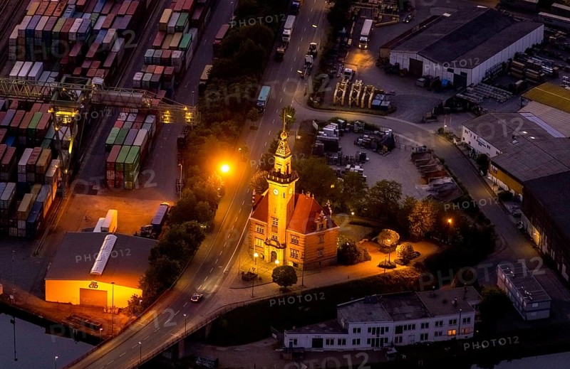 Aerial view, night view of Dortmund harbour, historic building old harbour office, coal port of the inland portDortmunder Hafen AG in Dortmund in the federal state of North Rhine-Westphalia, Germany, Dortmund, Ruhr area, North Rhine-Westphalia, DE, Europe, birds-eyes view, aerial view, aerial photography, aerial photography, overview, overview, bird's eye view, night flight, night shot, nightshot, twilight, inland port, inland port, Dortmund-Ems Canal, Speicherstraße