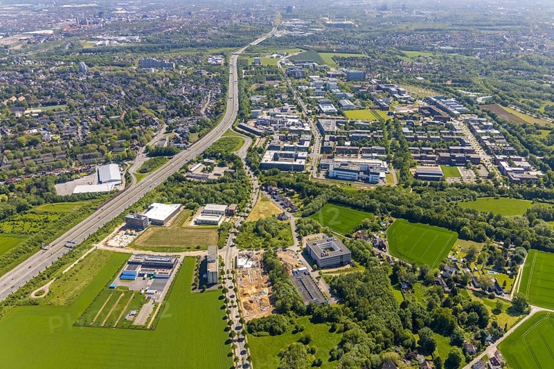 Aerial view, Dortmund University of Technology and Dortmund Technology Park, construction site and new construction Sebrathweg office quarter, A40 motorway, Oespel, Dortmund, Ruhr area, North Rhine-Westphalia, Germany, construction work, construction area, construction site, building plots, construction measure, row of trees, construction project, construction site, DE, Europe, commercial enterprises, commercial area, commercial area, commercial site, commercial use, university, industrial area, industrial site, aerial view, aerial photography, aerial photography, new building, TU Dortmund, Dortmund University of Technology, technology centre, overview, bird's-eye view, birds-eyes view, overview