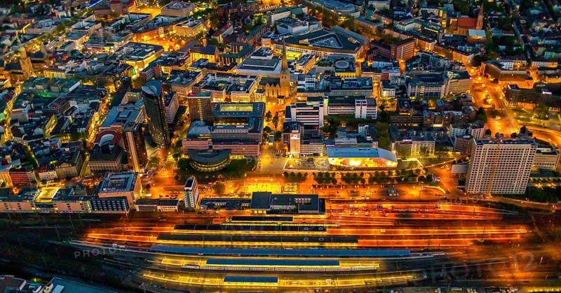Aerial view, Dortmund main station and city centre, Harenberg City-Center, RWE Tower, German Football Museum, City, Dortmund, Ruhr area, North Rhine-Westphalia, Germany, railway station, station forecourt, DE, Deutsche Bahn AG, twilight photography, Europe, football, HCC Dortmund, Harenberg Kommunikation Verlags- u. Medien GmbH, central station, main station, light pollution, aerial view, aerial photography, aerial photography, museum, night, night shot, night flight, Dortmund City and State Library, overview, bird's-eye view, illuminated streets, birds-eyes view, nightflight, overview