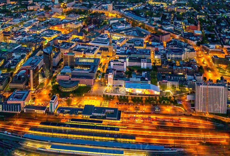 Aerial view, Dortmund main station and city centre, Harenberg City-Center, RWE Tower, German Football Museum, City, Dortmund, Ruhr area, North Rhine-Westphalia, Germany, railway station, station forecourt, DE, Deutsche Bahn AG, twilight photography, Europe, football, HCC Dortmund, Harenberg Kommunikation Verlags- u. Medien GmbH, central station, main station, light pollution, aerial view, aerial photography, aerial photography, museum, night, night shot, night flight, Dortmund City and State Library, overview, bird's-eye view, illuminated streets, birds-eyes view, nightflight, overview
