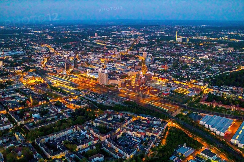 Aerial view, Dortmund main station and city centre, Dortmund U-Tower, city, Dortmund, Ruhr area, North Rhine-Westphalia, Germany, railway station, DE, Deutsche Bahn AG, twilight photography, Europe, main station, central station, culture, light pollution, aerial photography, aerial photography, aerial photography, night, night photography, night flight, overview, events, venue, event location, event centre, bird's eye view, illuminated streets, birds-eyes view, cultural use, nightflight, overview