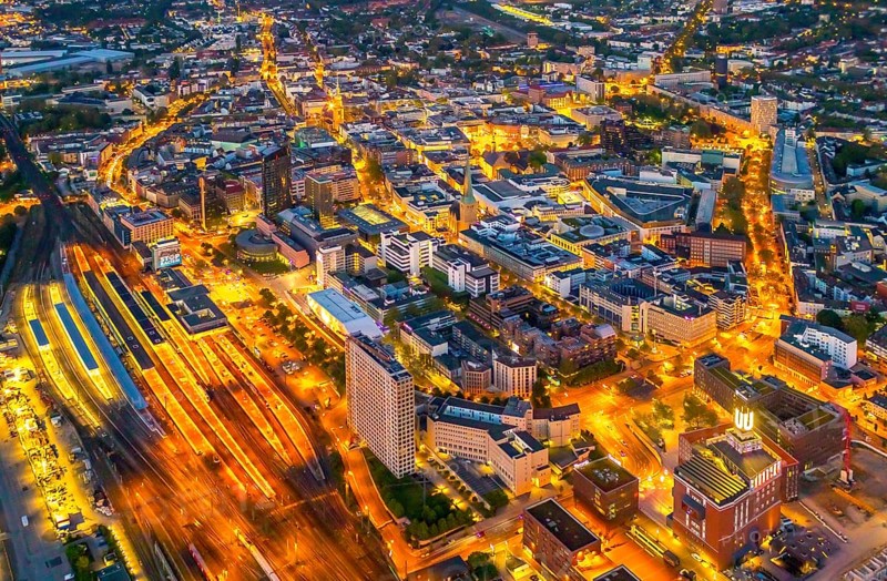 Aerial view, Dortmund main station and city centre, Harenberg City-Center, RWE Tower, German Football Museum, City, Dortmund, Ruhr area, North Rhine-Westphalia, Germany, railway station, station forecourt, DE, Deutsche Bahn AG, twilight photography, Europe, football, HCC Dortmund, Harenberg Kommunikation Verlags- u. Medien GmbH, central station, main station, light pollution, aerial view, aerial photography, aerial photography, museum, night, night shot, night flight, Dortmund City and State Library, overview, bird's-eye view, illuminated streets, birds-eyes view, nightflight, overview