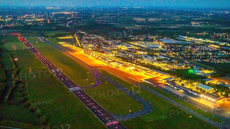 Aerial photo, Dortmund Airport, DTM, Wickede, Dortmund, Ruhr area, North Rhine-Westphalia, Germany, terminal building, DE, Dortmund Airport DTM, twilight photography, reception building, Europe, flight emission, airport, aircraft noise, airfield, runway, light pollution, aerial photograph, aerial photography, aerial photography, night, night photography, night flight, runway, overview, bird's-eye view, illuminated streets, birds-eyes view, nightflight, overview