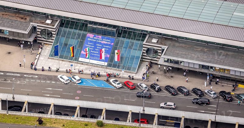 Aerial photo, Dortmund airport, departure level, arrival right of way, flags at airport entrance, EDLW, Wickede, Dortmund, Ruhr area, North Rhine-Westphalia, Germany, DE, Europe, birds-eyes view, aerial photography, aerial photography, aerial photography, overview, bird's eye view