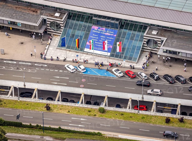 Aerial photo, Dortmund airport, departure level, arrival right of way, flags at airport entrance, EDLW, Wickede, Dortmund, Ruhr area, North Rhine-Westphalia, Germany, DE, Europe, birds-eyes view, aerial photography, aerial photography, aerial photography, overview, bird's eye view