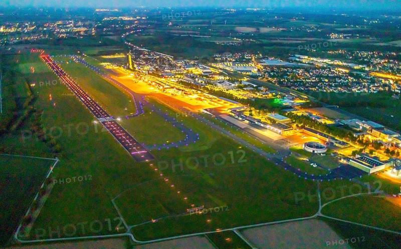 Aerial photo, Dortmund Airport, DTM, Wickede, Dortmund, Ruhr area, North Rhine-Westphalia, Germany, terminal building, DE, Dortmund Airport DTM, twilight photography, reception building, Europe, flight emission, airport, aircraft noise, airfield, runway, light pollution, aerial photograph, aerial photography, aerial photography, night, night photography, night flight, runway, overview, bird's-eye view, illuminated streets, birds-eyes view, nightflight, overview