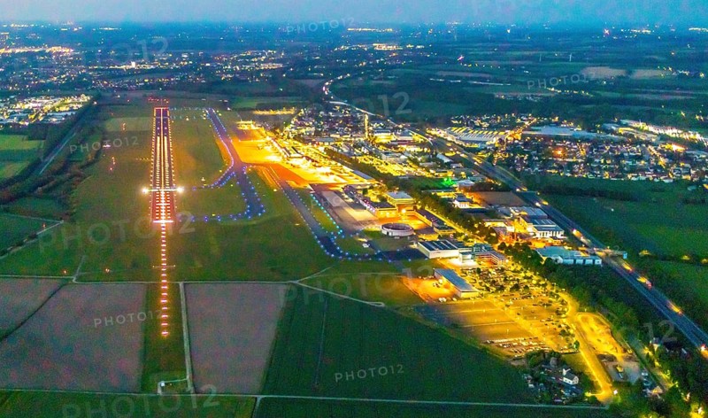 Aerial photo, Dortmund Airport, DTM, Wickede, Dortmund, Ruhr area, North Rhine-Westphalia, Germany, terminal building, DE, Dortmund Airport DTM, twilight photography, reception building, Europe, flight emission, airport, aircraft noise, airfield, runway, light pollution, aerial photograph, aerial photography, aerial photography, night, night photography, night flight, runway, overview, bird's-eye view, illuminated streets, birds-eyes view, nightflight, overview