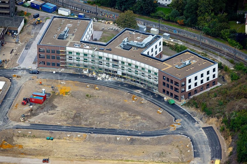 Aerial view, construction site Hombrucher Bogen for commercial areas and multi-family houses in the district Hombruch in Dortmund, Ruhr area, North Rhine-Westphalia, Germany, construction work, construction area, construction site, building plots, construction project, construction site, DE, Dortmund, Europe, aerial view, aerial photography, aerial photography, new building, snow, overview, bird's eye view, colliery square, birds-eyes view, former prefabricated concrete plant at Luisenglück, overview