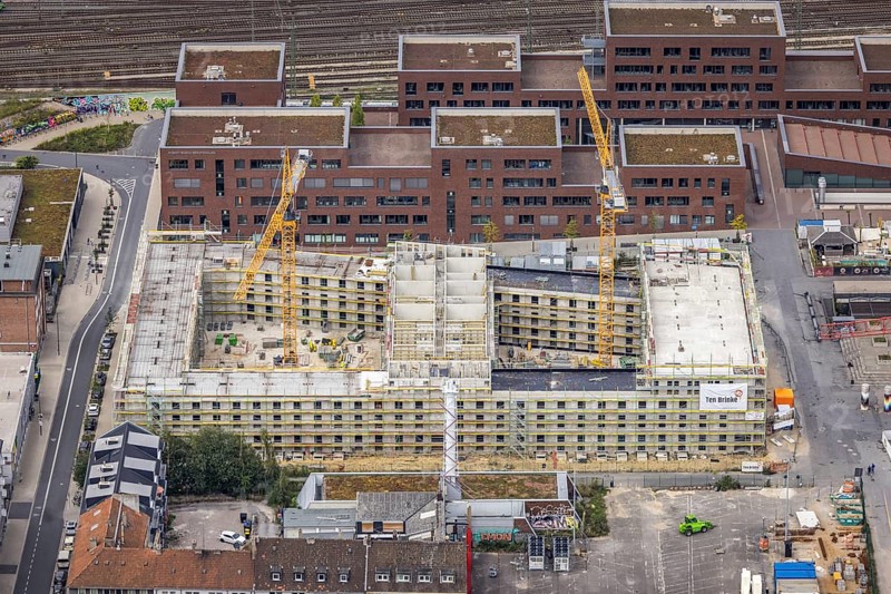 Aerial view, construction site and new construction of a residential complex at the Dortmund U-Tower with the Ostwall Museum and Leisure Centre West in the Dorstfelder Brücke district in Dortmund, Ruhr area, North Rhine-Westphalia, Germany, construction work, building, construction area, building site, building plots, construction crane, construction project, construction project, construction site, DE, Dortmund, Dortmunder U Centre for Art and Creativity, Emil-Moog-Platz, Europe, FZW, aerial view, aerial photography, aerial photography, new building, Robert-Bosch-Berufskolleg, overview, bird's-eye view, Centre for Art and Creativity, birds-eyes view, overview