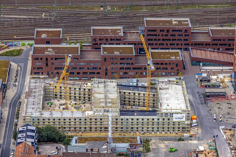 Aerial view, construction site and new construction of a residential complex at the Dortmund U-Tower with the Ostwall Museum and Leisure Centre West in the Dorstfelder Brücke district in Dortmund, Ruhr area, North Rhine-Westphalia, Germany, construction work, building, construction area, building site, building plots, construction crane, construction project, construction project, construction site, DE, Dortmund, Dortmunder U Centre for Art and Creativity, Emil-Moog-Platz, Europe, FZW, aerial view, aerial photography, aerial photography, new building, Robert-Bosch-Berufskolleg, overview, bird's-eye view, Centre for Art and Creativity, birds-eyes view, overview