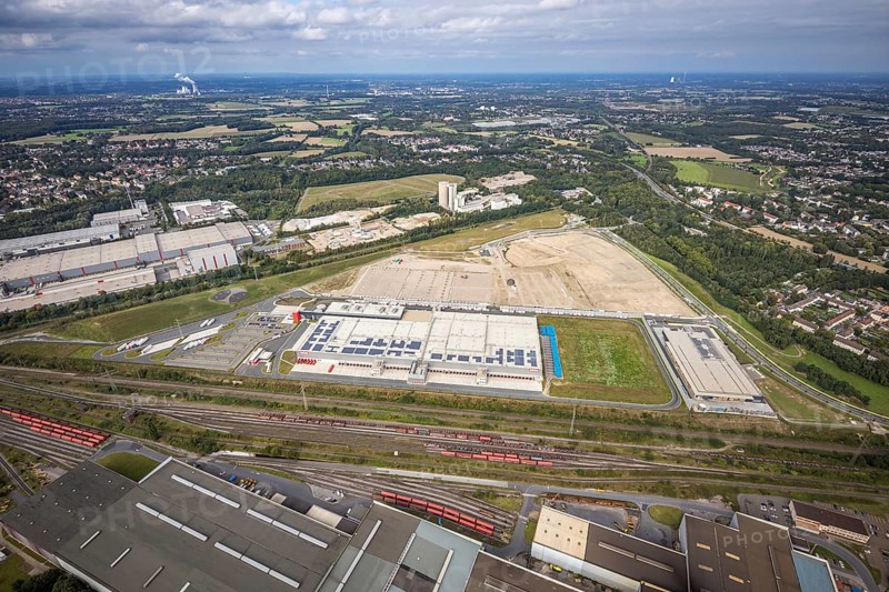 Aerial view, construction site with the new REWE logistics centre on Walzwerkstraße at the old Westfalenhütte in the Borsigplatz district of Dortmund, Ruhr area, North Rhine-Westphalia, Germany, construction area, building site, building plots, construction project, construction site, brownfield site, DE, Dortmund, Europe, commercial enterprises, commercial area, commercial area, commercial location, commercial use, industrial area, industrial location, logistics, logistics service, logistics service provider, logistics provider, logistics centre, aerial view, aerial photography, aerial photography, new construction, transport service, overview, bird's-eye view, overview