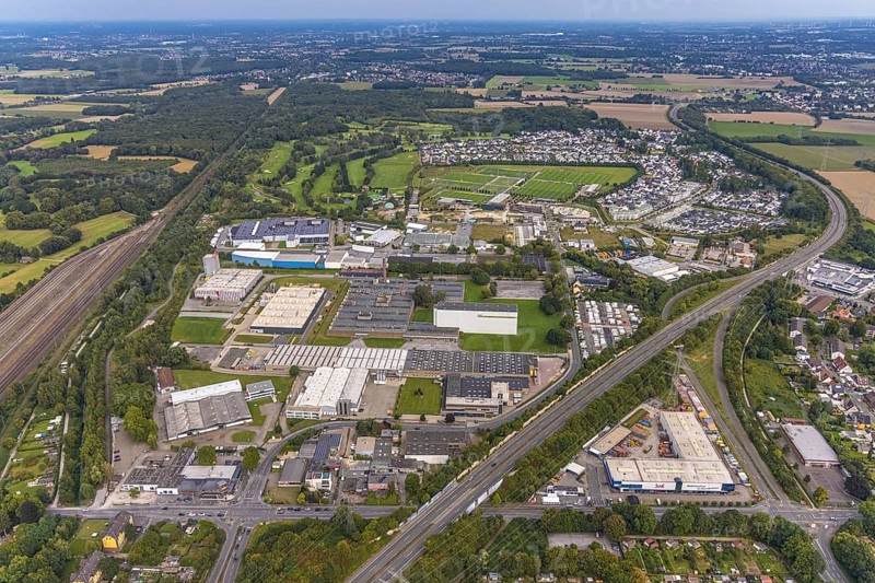 Aerial view, commercial area Heßlingsweg and BVB Borussia Dortmund training ground at Adi-Preißler-Allee in the district Brackel in Dortmund, Ruhr area, North Rhine-Westphalia, Germany, BVB 09 Borussia Dortmund, DE, Dortmund, Europe, football ground, commercial enterprises, commercial area, commercial area, commercial park, commercial location, commercial use, industrial area, industrial building, industrial location, aerial view, aerial photography, aerial photography, sports facilities, sports field, sports facility, training, overview, bird's eye view, birds-eyes view, overview
