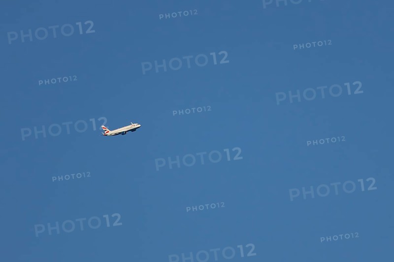 Airbus A320-232 jet passenger aircraft of British Airways airlines in flight in a blue sky, London, England, United Kingdom