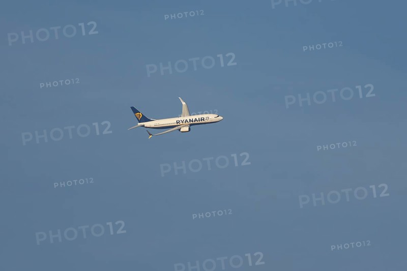 Boeing 737 jet passenger aircraft of Ryanair airlines in flight in a blue sky, Rome, Italy