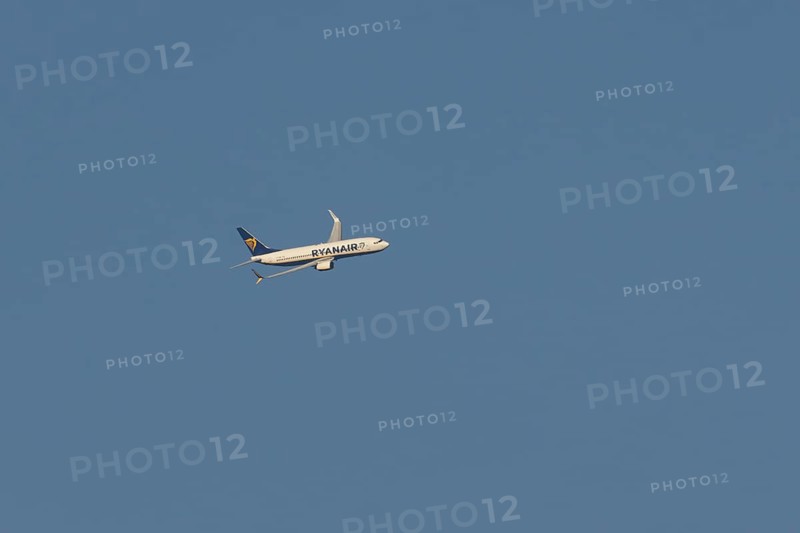 Boeing 737 jet passenger aircraft of Ryanair airlines in flight in a blue sky, Rome, Italy