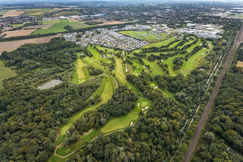 Aerial view, Royal Saint Barbara's Dortmund Golf Club and single-family house housing estate Brackeler Feld and BVB Borussia Dortmund training ground in the district Brackel in Dortmund, Ruhr area, North Rhine-Westphalia, Germany, DE, Dortmund, single-family houses, Europe, football pitch, golf, golf course, golf club, golf course, golf meadow, property tax, real estate, aerial view, aerial photography, aerial photography, sports, sports facilities, sports field, sports facility, overview, bird's eye view, residential area, residential area, residential buildings, residential quality, residential neighbourhood, housing estate, birds-eyes view, overview