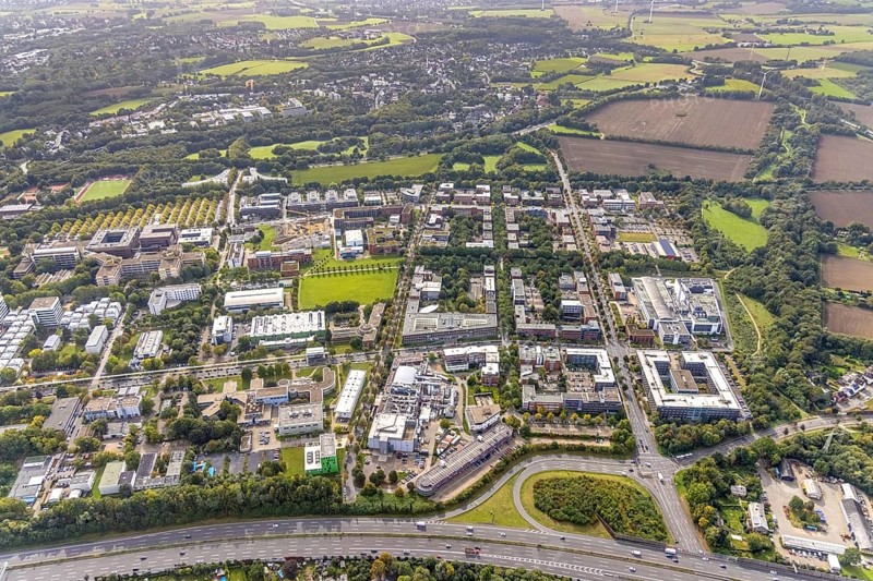 Aerial view of the TZDO - TechnologieZentrumDortmund GmbH, Technical University Dortmund Campus North with the Technology Centre and EMC Test North Rhine-Westphalia GmbH EMC Competence Centre as well as construction site for the CALEDO research centre next to the Faculty of Computer Science in the Oespel district of Dortmund, Ruhr area, North Rhine-Westphalia, Germany, A40 motorway, construction work, construction site, building plots, construction avenue, construction measure, construction project, construction site, education, educational institution, north campus, south campus, DE, Dortmund, Elmos Semiconductor SE, Emil-Figge-Straße, Europe, distant view, green area technology park, aerial view, aerial photograph, aerial photography, aerial photography, new building, TU Dortmund, Dortmund University of Technology, overview, University of Dortmund, bird's-eye view, overview
