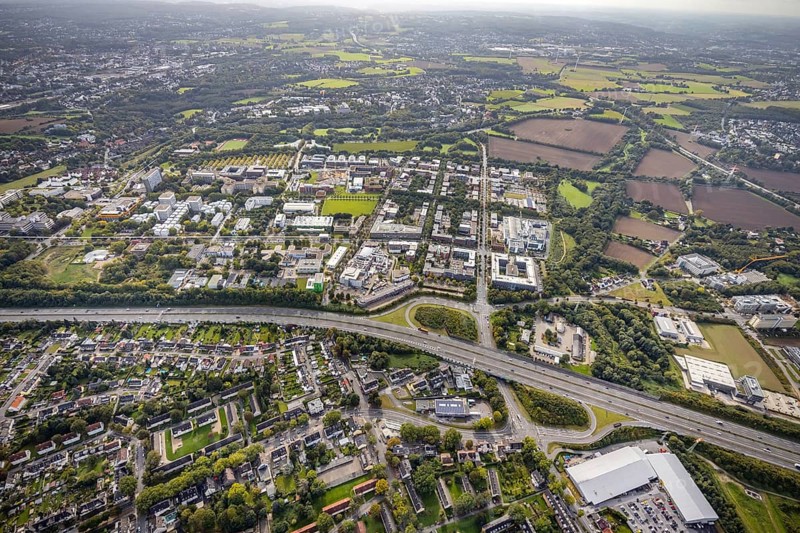 Aerial view of the TZDO - TechnologieZentrumDortmund GmbH, Technical University Dortmund Campus North with the Technology Centre and EMC Test North Rhine-Westphalia GmbH EMC Competence Centre as well as construction site for the CALEDO research centre next to the Faculty of Computer Science in the Oespel district of Dortmund, Ruhr area, North Rhine-Westphalia, Germany, A40 motorway, construction work, construction site, building plots, construction avenue, construction measure, construction project, construction site, education, educational institution, north campus, south campus, DE, Dortmund, Elmos Semiconductor SE, Emil-Figge-Straße, Europe, distant view, green area technology park, aerial view, aerial photograph, aerial photography, aerial photography, new building, TU Dortmund, Dortmund University of Technology, overview, University of Dortmund, bird's-eye view, overview