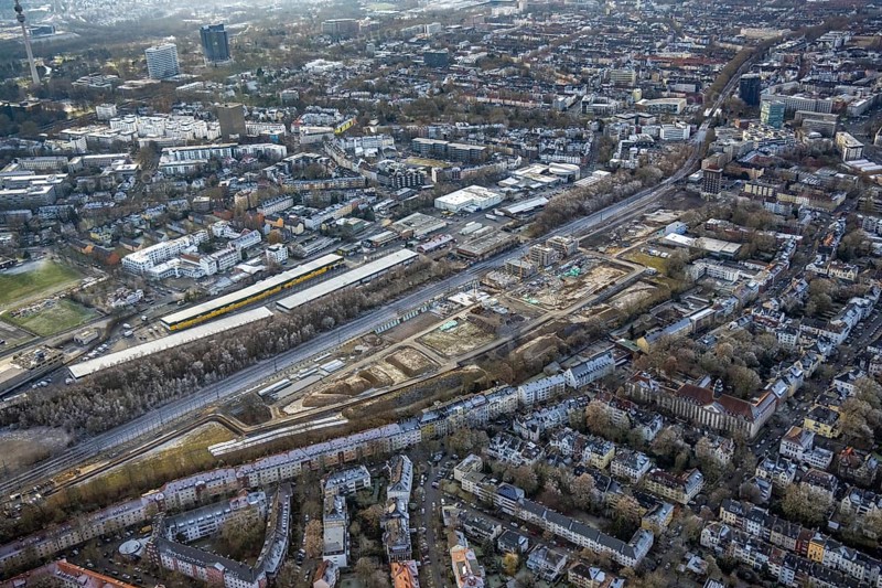 Aerial view, construction site Kronprinzenviertel for new construction of residential units Am Wasserturm Südbahnhof in the district Westfalendamm in Dortmund, Ruhr area, North Rhine-Westphalia, Germany, construction work, building monument, construction, construction area, building site, building plots, construction measure, construction project, construction site, DE, monument, Dortmund, Europe, aerial view, aerial photography, aerial photography, tower, overview, bird's-eye view, water tower Dortmunder Südbahnhof, housing estate, housing and living, residential area, residential quality, residential neighbourhood, housing estate, birds-eyes view, overview