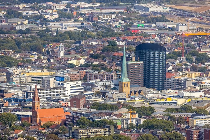 View of the city centre with the Church of Our Lady of the Holy Sepulchre, the Protestant Church of St. Peter, the Sparkasse Tower and the RWE Tower. Petri, Sparkassenhochhaus and RWE Tower in the City district of Dortmund, Ruhr area, North Rhine-Westphalia, Germany, place of worship, office tower, City, DE, Dortmund, Europe, religious community, place of worship, holy place, high-rise building, city centre, church, parish, denomination, RWE Vertrieb AG headquarters, aerial view, aerial photograph, aerial photography, aerial photography, local view, Petrikirche, RWE Tower, religion, religious site, skyline, townscape, city centre, overview, bird's-eye view, overview