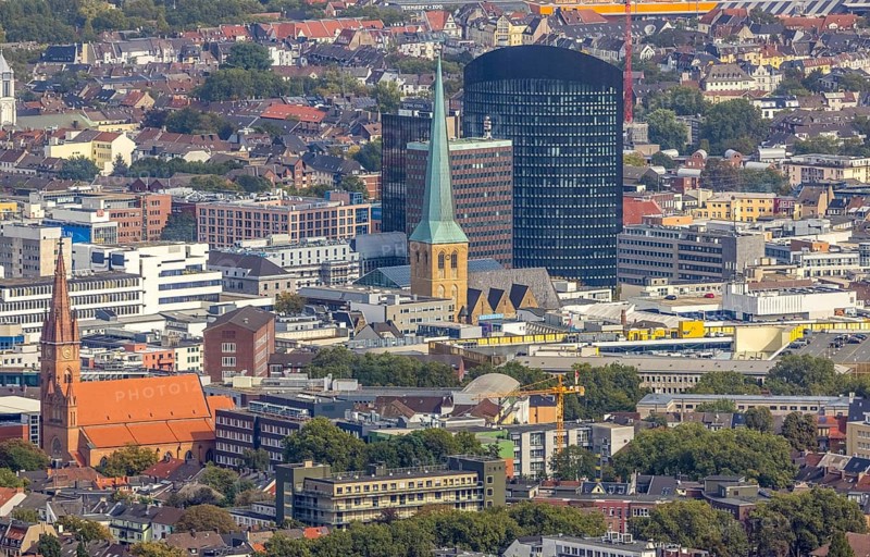 View of the city centre with the Church of Our Lady of the Holy Sepulchre, the Protestant Church of St. Peter, the Sparkasse Tower and the RWE Tower. Petri, Sparkassenhochhaus and RWE Tower in the City district of Dortmund, Ruhr area, North Rhine-Westphalia, Germany, place of worship, office tower, City, DE, Dortmund, Europe, religious community, place of worship, holy place, high-rise building, city centre, church, parish, denomination, RWE Vertrieb AG headquarters, aerial view, aerial photograph, aerial photography, aerial photography, local view, Petrikirche, RWE Tower, religion, religious site, skyline, townscape, city centre, overview, bird's-eye view, overview