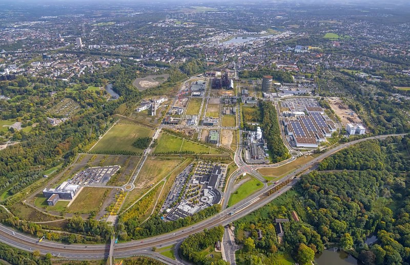 Phönix-West area and Hoesch-Gasometer with the Phoenix Lake in the background as well as Wilo Park, BMW branch Dortmund, INTECH Die Industrieausrüster and Amprion GmbH Stromversorger in the district Hörde in Dortmund, Ruhr area, North Rhine-Westphalia, Germany, Amprion GmbH Stromversorger, DE, monument protection, Dortmund, Europe, commercial enterprises, commercial area, commercial park, commercial location, commercial use, industrial area, industrial building, industrial location, innovation location, aerial view, aerial photograph, aerial photography, aerial photography, Phoenix-See, Phoenix-West, overview, bird's-eye view, birds-eyes view, former blast furnace plant, overview