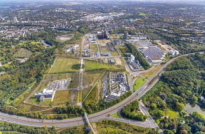 Phönix-West area and Hoesch-Gasometer with the Phoenix Lake in the background as well as Wilo Park, BMW branch Dortmund, INTECH Die Industrieausrüster and Amprion GmbH Stromversorger in the district Hörde in Dortmund, Ruhr area, North Rhine-Westphalia, Germany, Amprion GmbH Stromversorger, DE, monument protection, Dortmund, Europe, commercial enterprises, commercial area, commercial park, commercial location, commercial use, industrial area, industrial building, industrial location, innovation location, aerial view, aerial photograph, aerial photography, aerial photography, Phoenix-See, Phoenix-West, overview, bird's-eye view, birds-eyes view, former blast furnace plant, overview