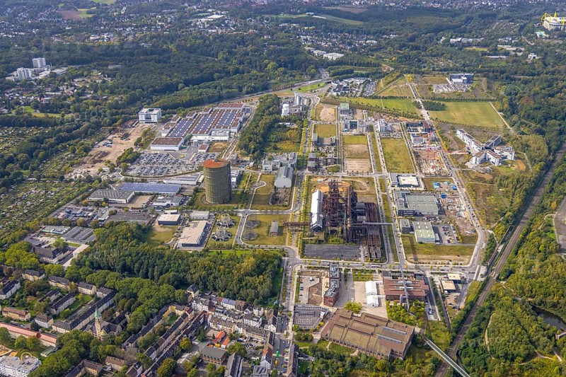 Phönix-West Areal and Hoesch-Gasometer as well as Wilo Park, BMW branch Dortmund, INTECH Die Industrieausrüster and Amprion GmbH Stromversorger in the district Hörde in Dortmund, Ruhr area, North Rhine-Westphalia, Germany, Amprion GmbH Stromversorger, DE, monument protection, Dortmund, Europe, commercial enterprises, commercial area, commercial area, commercial park, commercial location, commercial use, industrial area, industrial building, industrial location, innovation location, aerial view, aerial photograph, aerial photography, aerial photography, Phoenix-See, Phoenix-West, overview, bird's-eye view, birds-eyes view, former blast furnace plant, overview