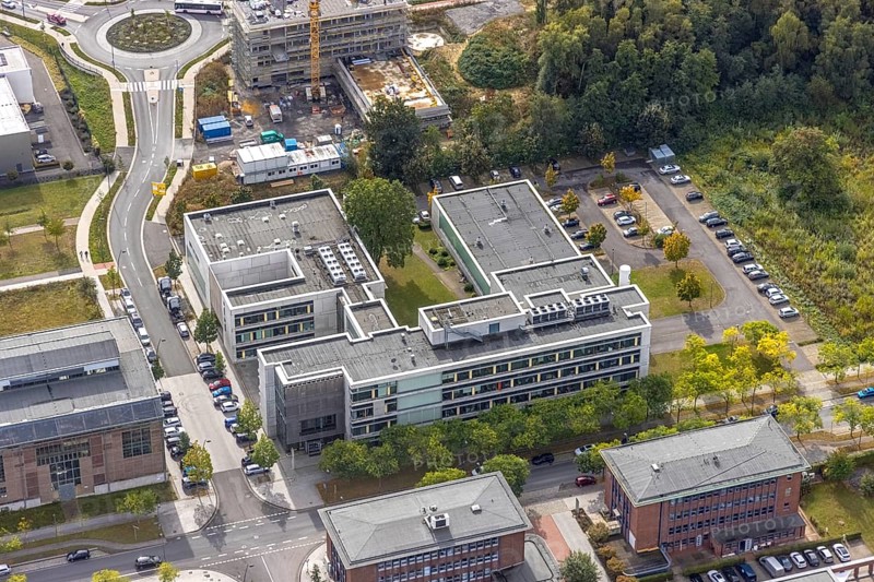 Phoenix-West area with company buildings MST Factory and ION-GAS GmbH on Konrad-Adenauer-Allee in the Hörde district of Dortmund, Ruhr area, North Rhine-Westphalia, Germany, Bartels Mikrotechnik GmbH, DE, Dortmund, Europe, commercial enterprises, commercial area, industrial estate, business park, commercial location, commercial use, industrial area, industrial building, industrial location, innovation location, aerial view, aerial photograph, aerial photography, aerial photography, Micronit GmbH, Phönix-West, overview, bird's-eye view, birds-eyes view, former blast furnace plant, overview, temicon GmbH