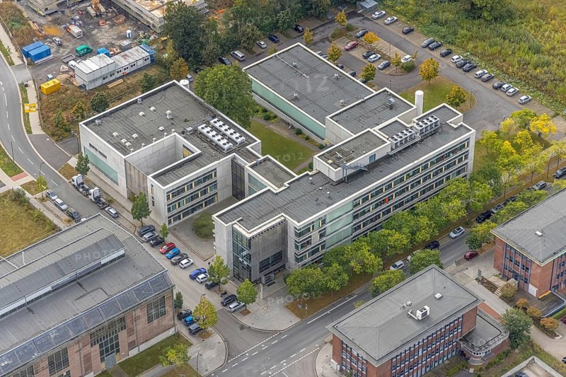 Phoenix-West area with company buildings MST Factory and ION-GAS GmbH on Konrad-Adenauer-Allee in the Hörde district of Dortmund, Ruhr area, North Rhine-Westphalia, Germany, Bartels Mikrotechnik GmbH, DE, Dortmund, Europe, commercial enterprises, commercial area, industrial estate, business park, commercial location, commercial use, industrial area, industrial building, industrial location, innovation location, aerial view, aerial photograph, aerial photography, aerial photography, Micronit GmbH, Phönix-West, overview, bird's-eye view, birds-eyes view, former blast furnace plant, overview
