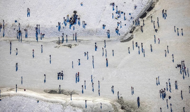 Aerial view, ice rink, ice skaters and pedestrians on frozen Rhine meadow in Lörrick near the Theodor-Heuss-Bridge, Niederkassel, Düsseldorf, Rhineland, North Rhine-Westphalia, Germany, DE, Europe, shapes and colours, aerial view, aerial photography, aerial photography, ice skating, snow, overview, bird's eye view, winter, birds-eyes view, overview
