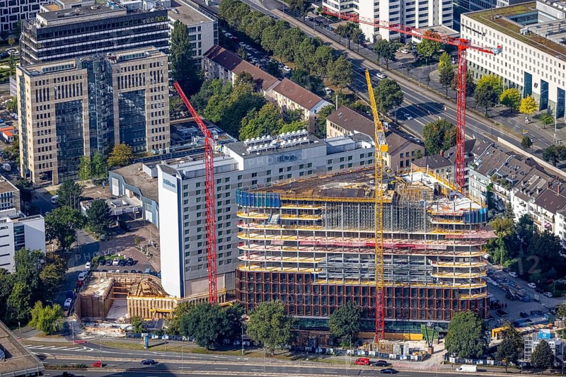 Aerial view, construction site and new construction triangular office tower Eclipse next to the Hilton Hotel at Kennedydamm in the district Golzheim in Düsseldorf, Rhineland, North Rhine-Westphalia, Germany, construction work, construction area, construction site, building plots, construction project, construction site, DE, triangular shape, Düsseldorf, Europe, gastronomy, hotel, hotel facilities, hotel industry, aerial view, aerial photography, aerial photography, new construction, overview, bird's eye view, birds-eyes view, overview