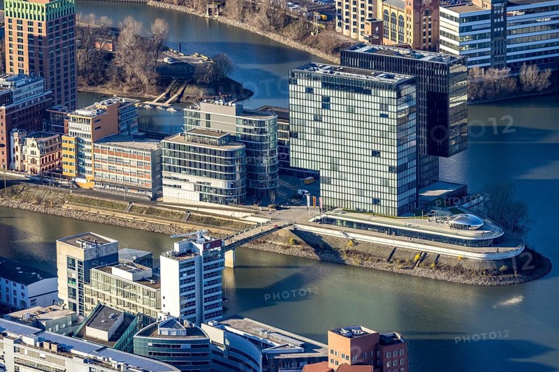 Aerial view, office buildings and commercial buildings in the media harbour with Hyatt Regency Düsseldorf in the harbour in Düsseldorf, Rhineland, North Rhine-Westphalia, Germany, DE, Düsseldorf, Europe, commercial enterprises, commercial area, commercial park, commercial location, commercial use, harbour area, industrial area, industrial location, aerial photograph, aerial photography, aerial photography, overview, bird's eye view, birds-eyes view, overview