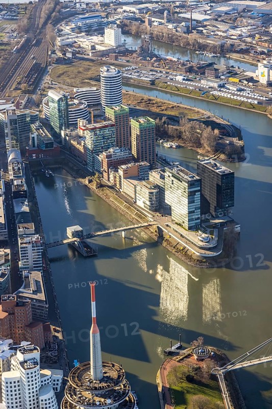 Aerial view, office buildings and commercial buildings in the media harbour with Hyatt Regency Düsseldorf in the harbour in Düsseldorf, Rhineland, North Rhine-Westphalia, Germany, DE, Düsseldorf, Europe, commercial enterprises, commercial area, commercial park, commercial location, commercial use, harbour area, industrial area, industrial location, aerial photograph, aerial photography, aerial photography, overview, bird's eye view, birds-eyes view, overview