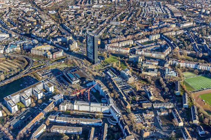 Aerial view, ARAG Tower with construction site on Mercedesstraße with new construction of an office and residential complex in the Düsseltal district of Düsseldorf, Rhineland, North Rhine-Westphalia, Germany, ARAG high-rise building, construction work, construction, construction area, construction site, building plots, construction crane, construction measure, construction project, construction site, CG Gruppe AG, DE, Düsseldorf, development, Europe, commercial buildings, property tax, high-rise buildings, real estate, capacity requirements, aerial view, aerial photography, aerial photography, new construction, overview, bird's-eye view, residential complex, living and working, residential area, residential buildings, birds-eyes view, overview