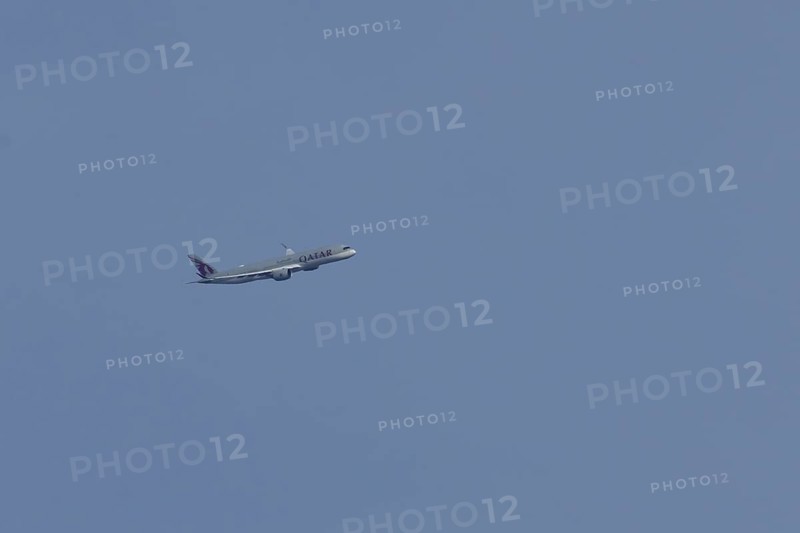 Airbus A350 jet passenger aircraft of Qater airlines flying in a blue sky, England, United Kingdom