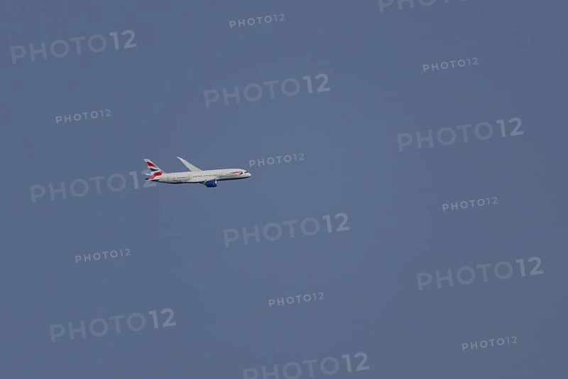 Boeing 787-9 Dreamliner jet passenger aircraft of British Airways airlines in flight in a blue sky, London, England, United Kingdom